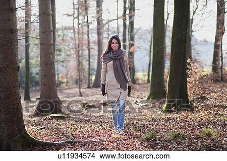 Older woman walking in forest View Large Photo Image Picture - Older woman walking in forest. Fotosearch