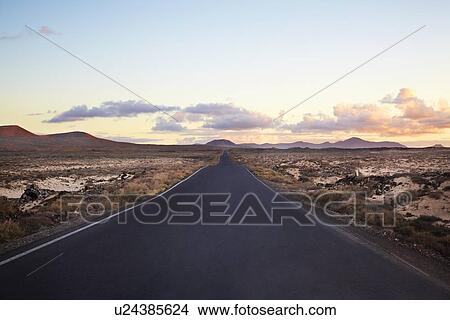 Picture - Paved road in rural landscape. Fotosearch