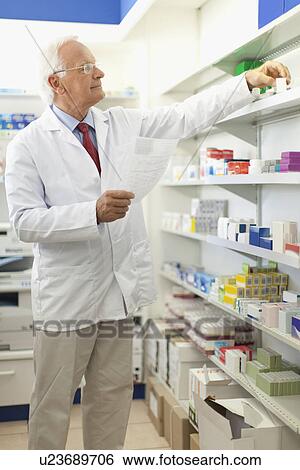 Pharmacist filling prescription View Large Photo Image Stock Photograph - Pharmacist filling prescription. Fotosearch