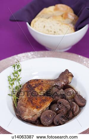 Stock Photo - Plate of coq au vin. Fotosearch