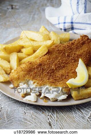 Plate of fish and chips with lemon View Large Photo Image Stock Photograph - Plate of fish and chips with lemon. Fotosearch