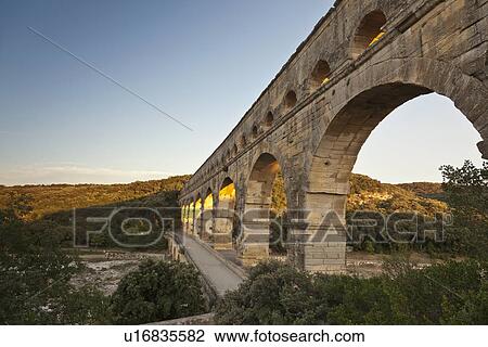 Pont du Gard bridge in rural landscape View Large Photo Image Stock Image - Pont du Gard bridge in rural landscape. Fotosearch