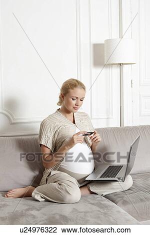 Pregnant woman shopping online View Large Photo Image Stock Image - Pregnant woman shopping online. Fotosearch