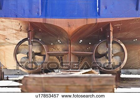 Stock Photo - Propellers of ship on dry dock. Fotosearch