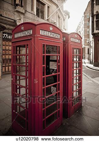 Red telephone box on city street View Large Photo Image Stock Photo - Red telephone box on city street. Fotosearch