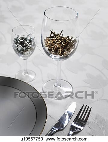 Screws in wine glasses at table View Large Photo Image Stock Image - Screws in wine glasses at table. Fotosearch
