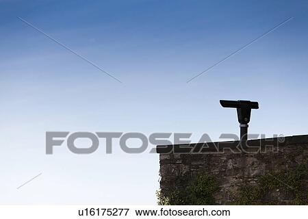 Silhouette of binoculars on stone wall View Large Photo Image Stock Photo - Silhouette of binoculars on stone wall. Fotosearch