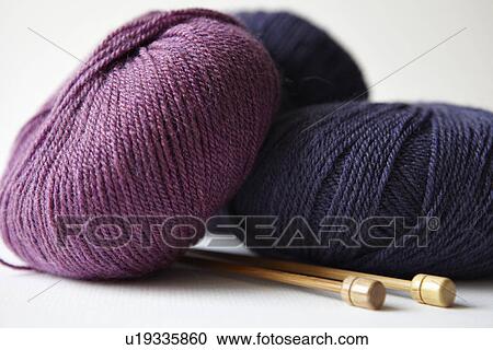 Stock Image - Skeins of yarn and knitting needles. Fotosearch