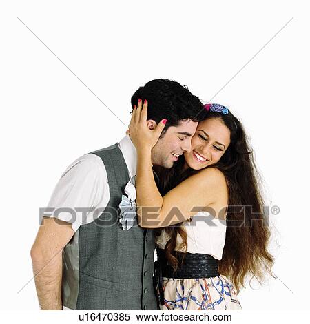 Stock Photography - Smiling couple hugging. Fotosearch