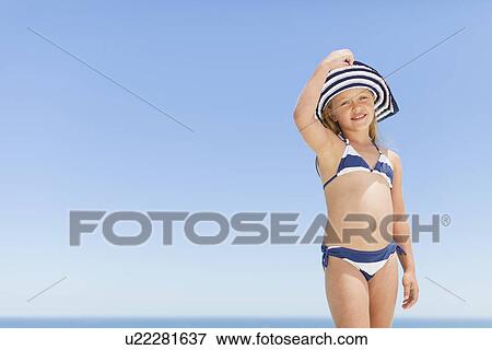 Smiling girl wearing bikini outdoors View Large Photo Image Stock Photo - Smiling girl wearing bikini outdoors. Fotosearch