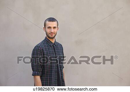 Smiling man standing outdoors View Large Photo Image Stock Image - Smiling man standing outdoors. Fotosearch