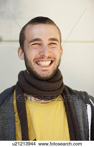 Smiling man wearing scarf indoors View Large Photo Image Picture - Smiling man wearing scarf indoors. Fotosearch