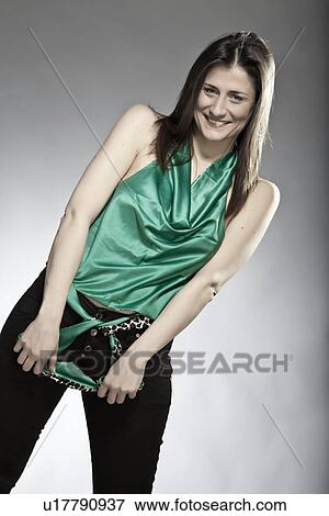 Stock Photo - Smiling woman in sleeveless blouse. Fotosearch
