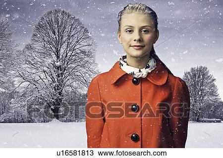Smiling woman standing in snow View Large Photo Image Stock Image - Smiling woman standing in snow. Fotosearch