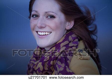 Smiling woman walking on beach View Large Photo Image Stock Image - Smiling woman walking on beach. Fotosearch