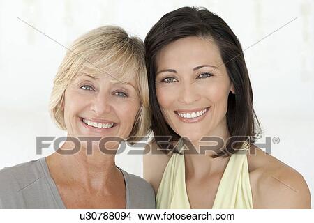 Picture - Smiling women standing together. Fotosearch