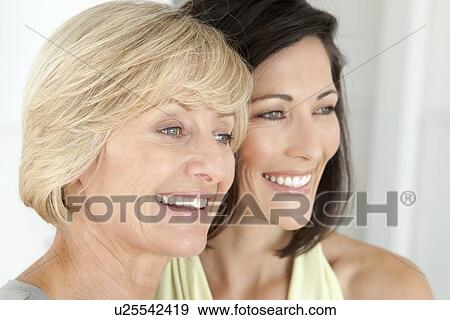 Smiling women standing together View Large Photo Image Stock Photo - Smiling women standing together. Fotosearch