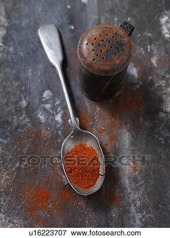 Spoonful of paprika spice on countertop View Large Photo Image Stock Photo - Spoonful of paprika spice on countertop. Fotosearch
