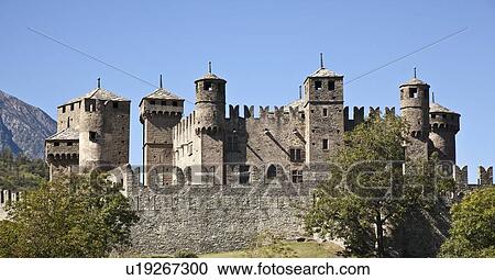 Stock Image - Stone castle in rural landscape. Fotosearch