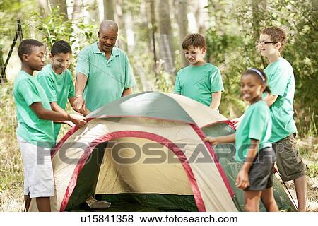 Students pitching tent with teacher View Large Photo Image Stock Photo - Students pitching tent with teacher. Fotosearch