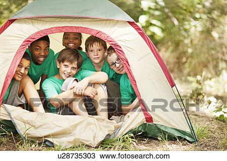 Students sitting in camp tent View Large Photo Image Stock Image - Students sitting in camp tent. Fotosearch