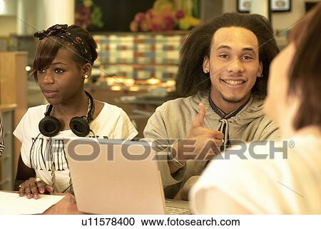 Students working together in cafe View Large Photo Image Stock Image - Students working together in cafe. Fotosearch
