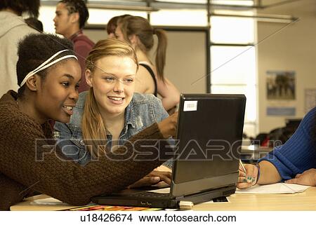 Students working together in library View Large Photo Image Picture - Students working together in library. Fotosearch