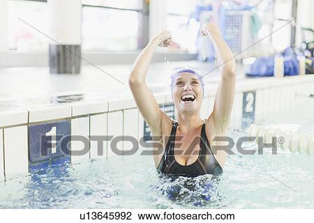 Swimmer cheering in pool View Large Photo Image Stock Image - Swimmer cheering in pool. Fotosearch