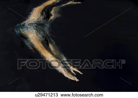 Swimmer diving into pool View Large Photo Image Stock Image - Swimmer diving into pool. Fotosearch