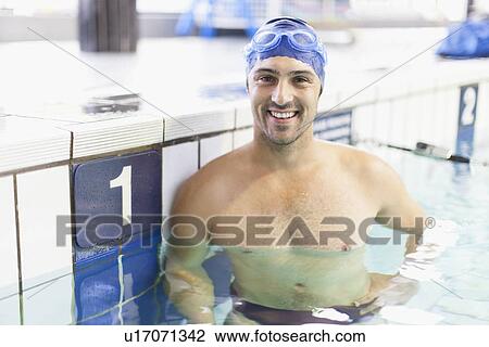 Stock Image - Swimmer in first pool lane. Fotosearch