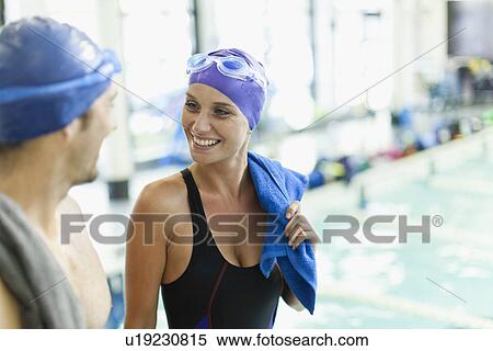 Swimmers talking by pool View Large Photo Image Stock Photography - Swimmers talking by pool. Fotosearch
