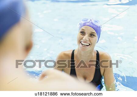 Swimmers talking in pool View Large Photo Image Stock Photograph - Swimmers talking in pool. Fotosearch