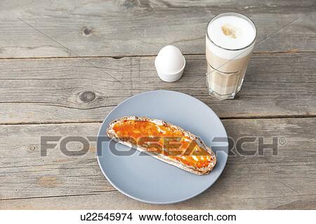 Picture - Toast with jam, egg and cup of coffee. Fotosearch