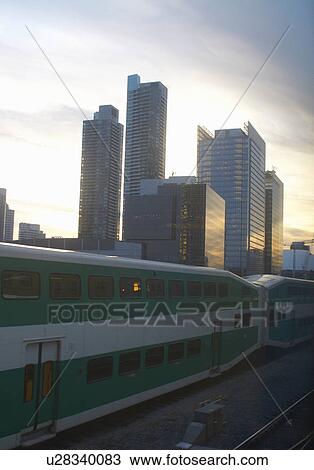 Train passing by Toronto city skyline View Large Photo Image Stock Image - Train passing by Toronto city skyline. Fotosearch