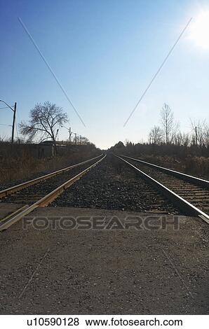 Stock Photo - Train tracks in rural landscape. Fotosearch