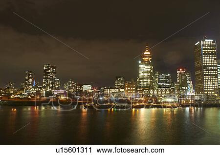 Stock Image - Vancouver skyline lit up at night. Fotosearch