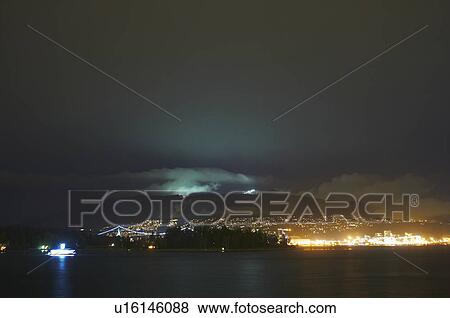 Stock Photo - Vancouver skyline lit up at night. Fotosearch
