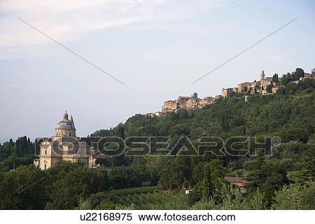 Stock Photography - Village and cathedral on rural hillside. Fotosearch