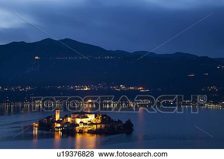 Stock Photo - Village on island lit up at night. Fotosearch