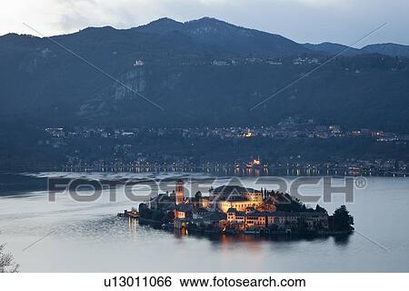 Village on island lit up at night View Large Photo Image Stock Photograph - Village on island lit up at night. Fotosearch