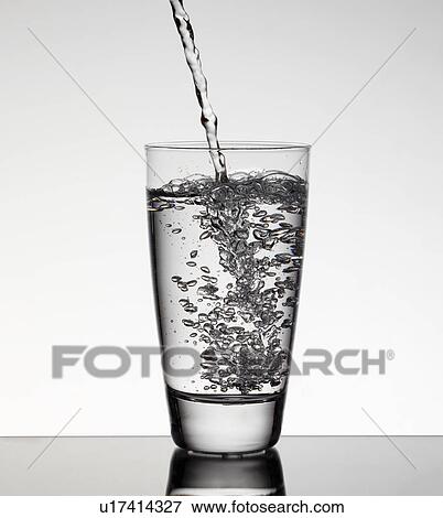 Water pouring into glass View Large Photo Image Stock Photo - Water pouring into glass. Fotosearch