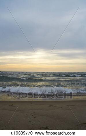 Waves crashing on sandy beach View Large Photo Image Stock Image - Waves crashing on sandy beach. Fotosearch