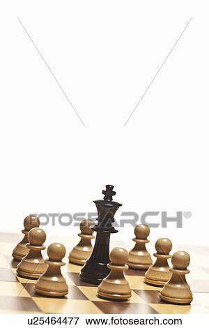 White pawns surrounding black chess king View Large Photo Image Stock Photo - White pawns surrounding black chess king. Fotosearch