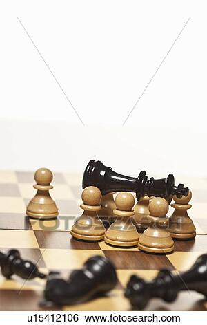 White pawns surrounding black chess king View Large Photo Image Stock Photograph - White pawns surrounding black chess king. Fotosearch