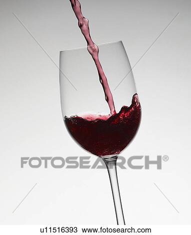 Wine pouring into wine glass View Large Photo Image Stock Image - Wine pouring into wine glass. Fotosearch
