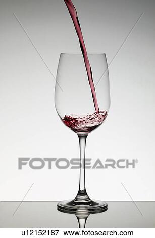 Wine pouring into wine glass View Large Photo Image Stock Photo - Wine pouring into wine glass. Fotosearch
