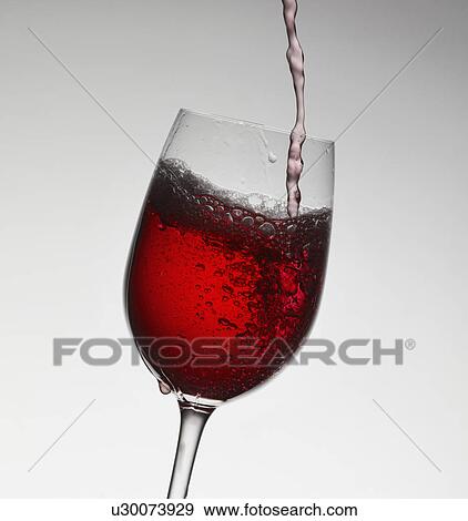 Wine pouring into wine glass View Large Photo Image Stock Photo - Wine pouring into wine glass. Fotosearch