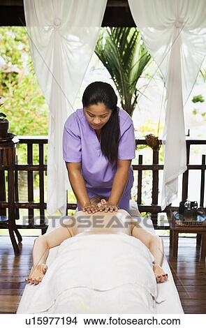 Woman having back massage in spa View Large Photo Image Picture - Woman having back massage in spa. Fotosearch