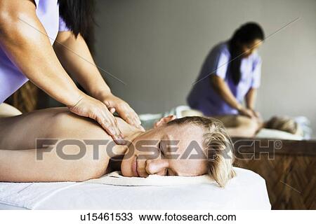 Woman having back massage in spa View Large Photo Image Stock Image - Woman having back massage in spa. Fotosearch