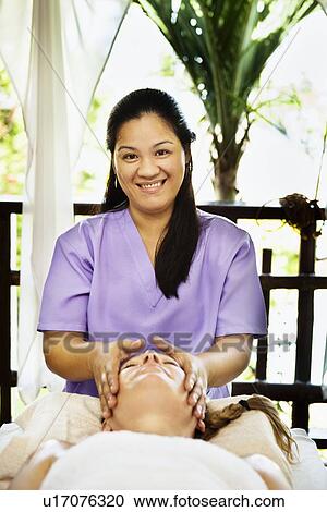 Woman having facial in spa View Large Photo Image Stock Image - Woman having facial in spa. Fotosearch